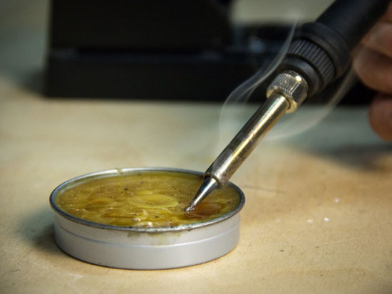 A soldering iron and rosin. 
